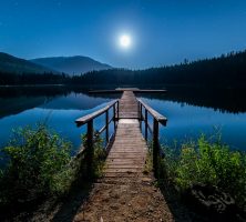 Wooden Dock Overlooking Lake Under Moonlight